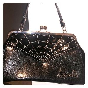 Sourpuss spiderweb purse